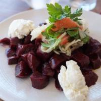 Beet Salad · Marinated red beets, arugula, almonds, fennel, parsley, truffled goat cheese spread and pome...