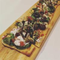 Mediterranean Flatbread · Spinach, artichoke, olives, roasted peppers, feta, pickled onion and balsamic reduction.