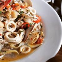 Seafood Pasta · Linguine, shrimp, crab, scallops, calamari, clams, tomato and white wine sauce.