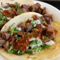 Lengua Taco · 3 lengua tacos, served naked. Please add onions and cilantro if you'd like them.