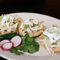 Sopes · 3 Sopes 
Fried Masa Dough Topped with Re fried Beans, Lettuce, Guacamole, Sour Cream and che...