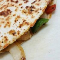 Fajita Quesadilla · Flour tortilla filled with cheese, bell peppers, onions, and a side of guacamole