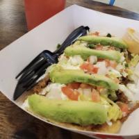 Huarache  · Huaraches are a tasty oblong corn masa dough fried and topped with your choice of meat, refr...