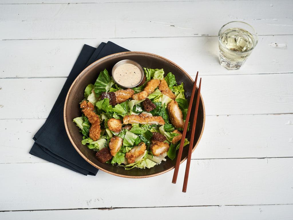 Caesar Salad · Fresh romaine lettuce topped with Parmesan, croutons and creamy caesar dressing. Vegetarian.