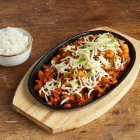 Bull Dak · Spicy chicken is stir-fried with rice cakes and Bonchon signature hot sauce, topped with thi...