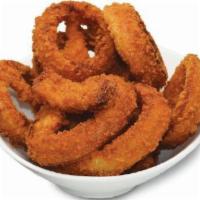 Onion Rings · Thick slices of onions in a crunchy batter served golden brown with a side of ketchup. Veget...
