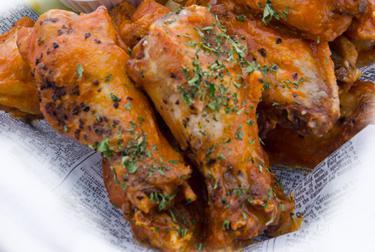 Buffalo Chicken Wings · Classic style wings in your choice of sauce (mild, medium, hot, nitro, or garlic Parmesan) with celery sticks, carrot sticks, and fries. Blue cheese or ranch dressing.