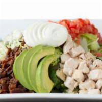 Chef's Chopped Cobb · Chilled romaine lettuce topped with diced chicken, applewood smoked bacon, bleu cheese crumb...
