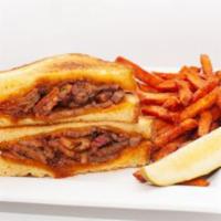BBQ Brisket Grilled Cheese · Texas toast grilled cheese with Cheddar cheese, smoked brisket and BBQ sauce.