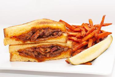 BBQ Brisket Grilled Cheese · Texas toast grilled cheese with Cheddar cheese, smoked brisket and BBQ sauce.