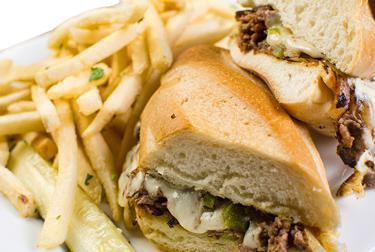 South Philly Cheese Steak · Shaved sirloin grilled with onions, peppers, and smothered with provolone cheese, served on fresh hoagie roll.