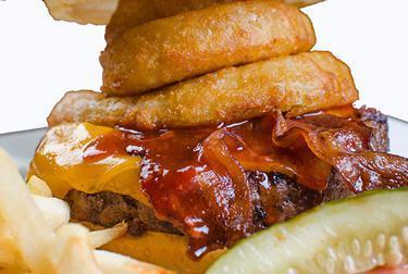 Western Bacon Burger · Fresh grilled ground chuck patty, topped with our house BBQ sauce, applewood bacon, cheddar cheese and onion rings.