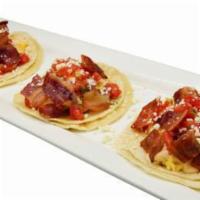 Hangover Street Tacos · Scrambled eggs, melted cheddar-Jack cheese, applewood bacon, pico de gallo and corn tortilla...