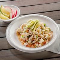 Shrimp Ceviche Tostada · Shrimp Ceviche Tostada marinated in lime juice and our special blend of spices. Garnished wi...