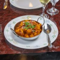 Aloo Gobhi Masala · Cauliflower & potatoes cooked with tomato, onion, herbs & spices garnished with fresh corian...