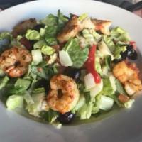 Hearts of Palm Salad · Romaine lettuce topped with hearts of palm, artichokes, Kalamata olives, tomatoes, roasted r...