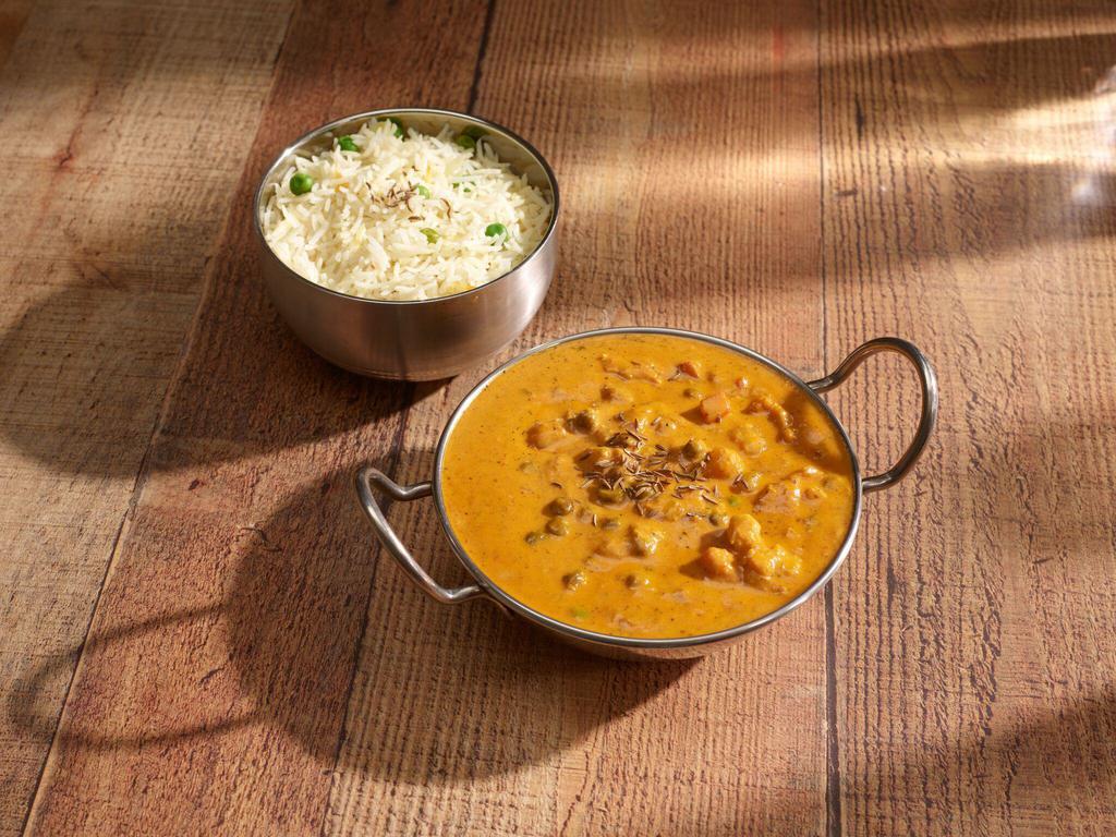 Korma · An aromatic mild curry with ground almonds, cashews and cream.