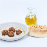 Hummus Falafel · Fresh hummus served with 4 Falafel balls, olive oil, and tahini. Comes with fresh pita.