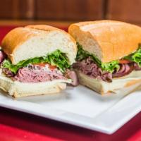 Roast Beef Sandwich · Medium rare sliced beef served on a soft French roll with Provolone cheese, mayo, horseradis...