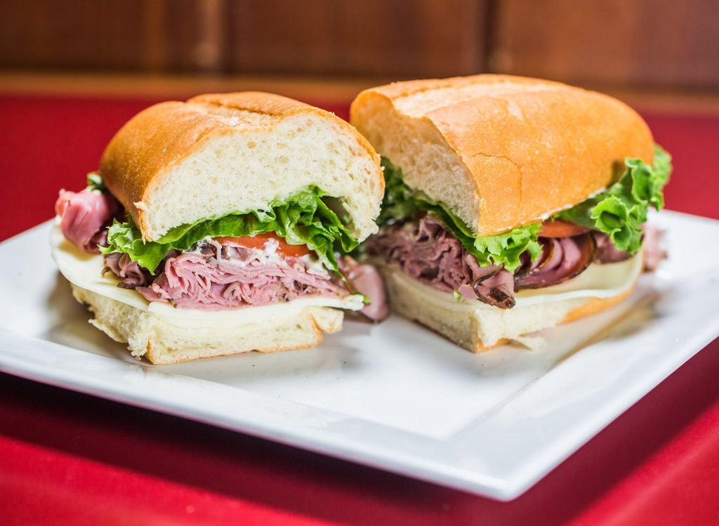 Roast Beef Sandwich · Medium rare sliced beef served on a soft French roll with Provolone cheese, mayo, horseradish sauce, lettuce and tomato.