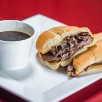 French Dip Sandwich · Grilled roast beef served on a warm French roll with melted Swiss cheese and a cup of au jus...