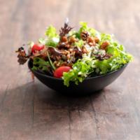Bistro Salad · Assorted field greens, chopped tomato, crumbled blue cheese and glazed walnuts. Choice of dr...