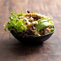California Chicken Salad · Marinated grilled chicken on a garden salad with avocado, garbanzo beans, red onion, and fet...