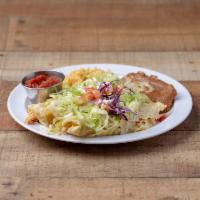 Enchiladas Suizas · 3 chicken enchiladas with cheese dip on top. Served with rice and beans, lettuce, tomatoes a...