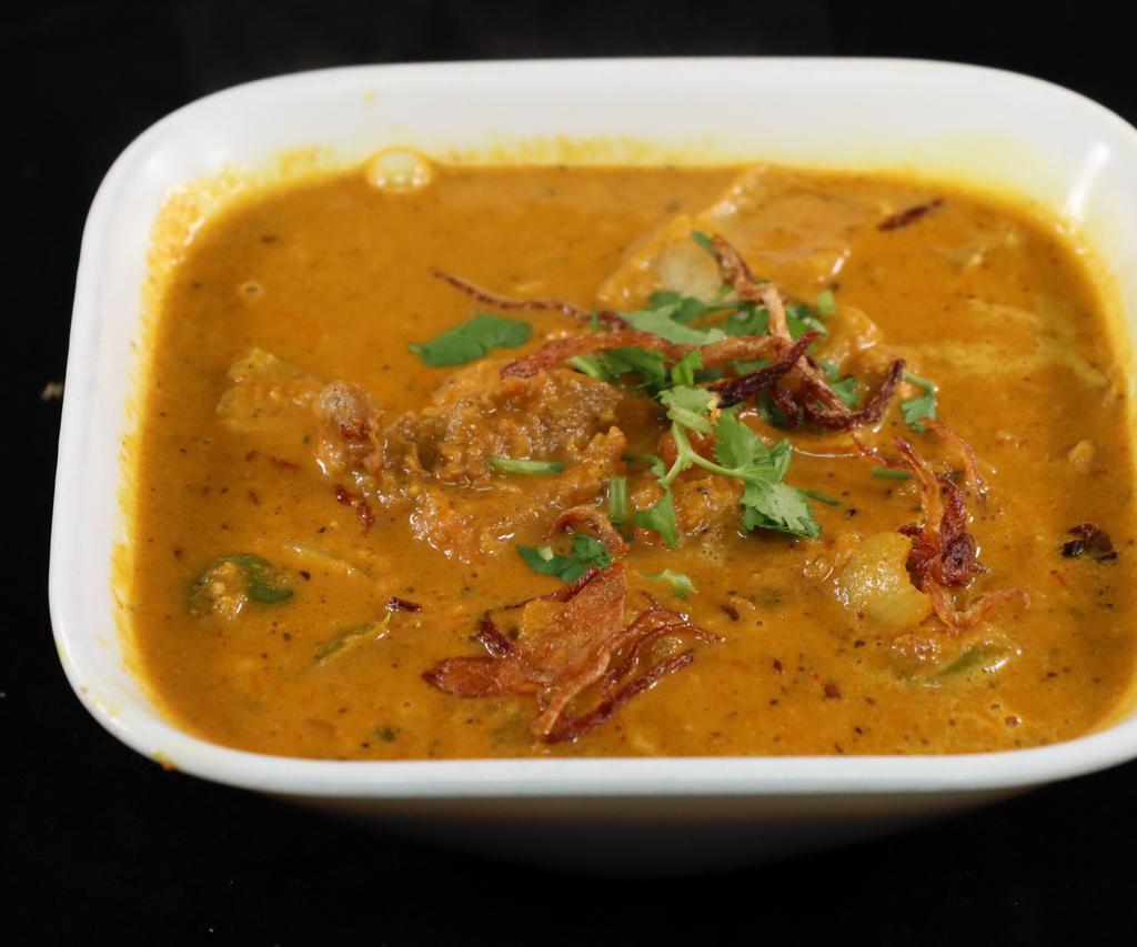 Kadai Goat · Goat cooked in a tomato and onion gravy base. This dish only requires 1 kadai (utensil) to get cooked.