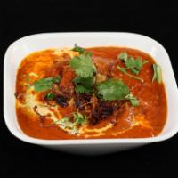Chicken Butter Masala · Chicken. Makhani is nothing but butter. Marinated chicken cooked in a mild curry base featur...