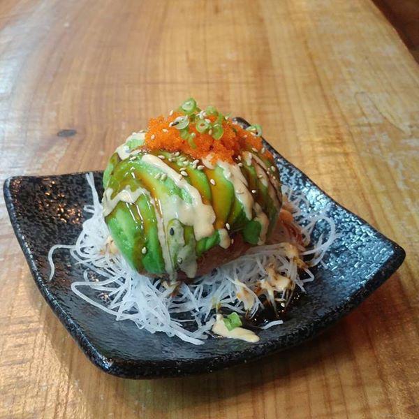 Avocado Ball · Spicy tuna wrapped in avocado slices with spicy aioli.