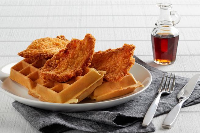 Fried Chicken & Waffles · Crispy breaded chicken and two malted waffles with maple syrup.