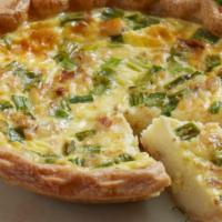 Quiche Lorraine · House-made with hickory-smoked bacon, green onion, mozzarella and aged Parmesan.