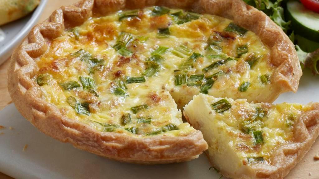 Quiche Lorraine · House-made with hickory-smoked bacon, green onion, mozzarella and aged Parmesan.