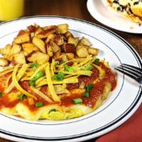 Sante Fe Omelet · Three eggs, diced jalapenos, cilantro, tomatoes, onions,   tortilla strips, melted monterey ...