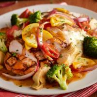 Tuscan-Style Grilled Chicken · Grilled chicken, mashed potatoes, sautéed vegetables and artichoke hearts served in a savory...