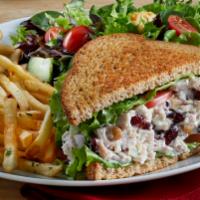 Turkey Royale · Diced roasted turkey and cranberry-walnut salad with lettuce, tomato, and mayonnaise on toas...