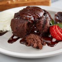 Molten Lava Cake · Warm molten chocolate cake with vanilla ice cream and a strawberry.