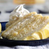 Lemon layer Cake · Meyer lemon cake with zesty custard, frosting and whipped cream.
