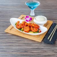 Fire Cracker Shrimp - OTG · 6 pieces lightly battered jumbo shrimp, tossed in garlic and Sambal sauce, served with sauté...