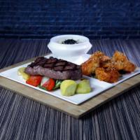 Steak and Shrimp - OTG · 8oz NY strip and 4 pieces jumbo Firecracker Shrimp served with sautéed vegetables and white ...