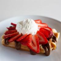 Nutella Love Waffle · Nutella, choice of fruit and fresh whipped cream.