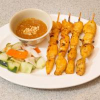 11. Malaysian Satay · 4 sticks. Marinated chicken or beef grilled on skewers. Served with homemade peanut sauce.