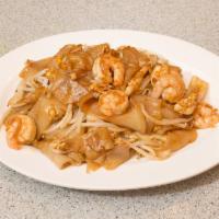 22. Chow Kueh Teow · Malaysian famous flat rice noodles with shrimp, squid, eggs and bean sprouts in a black soy ...