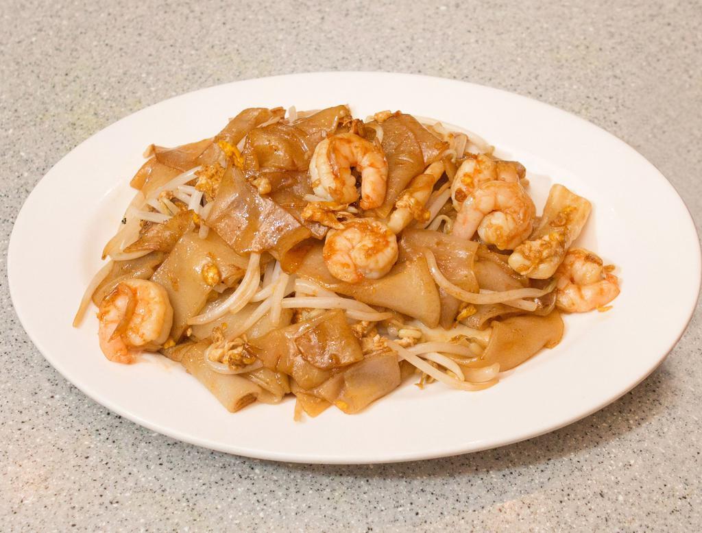 22. Chow Kueh Teow · Malaysian famous flat rice noodles with shrimp, squid, eggs and bean sprouts in a black soy sauce.