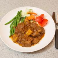 29. Beef Rendang · Tender beef slow cooked with a paste of ground onions, lemongrass, chili and potato. Simmere...