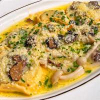 Ravioli Aux Champignons · Mushrooms, ricotta, truffle beurre fondue

