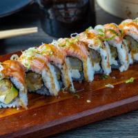 Nibui Passion Maki · Filled with shrimp tempura, avocado, cream cheese, topped with torched salmon
and passion fr...