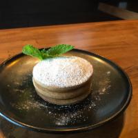 Alfajores · Layered butter shortbread cookie filled with dulce de leche and dusted with confectioners’ s...