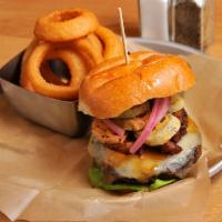 The Butcher Burger · White cheddar and pepper jack, hydro bibb lettuce, pickled onion, topped with crispy pork be...